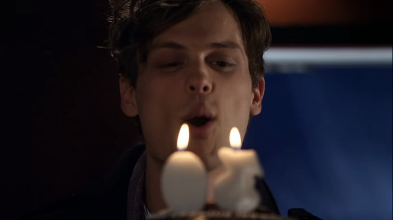 Spencer Reid blows out birthday cake candles
