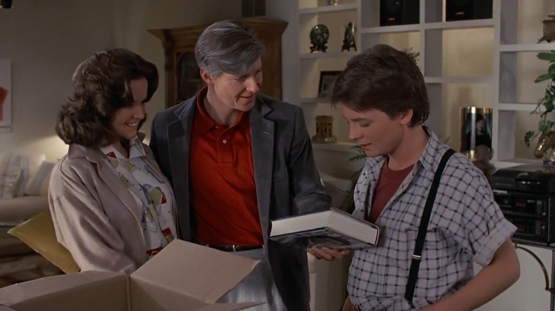 George McFly holding a book