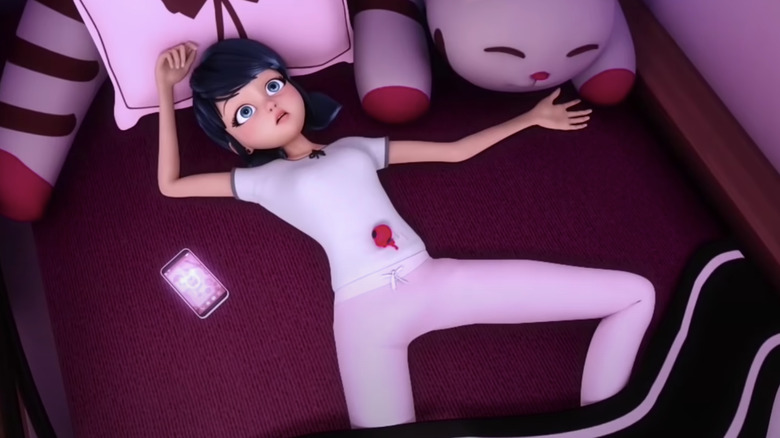 Marinette laying in bed