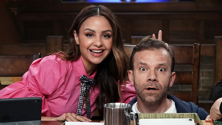 Aimee Carrero wears a pink shirt