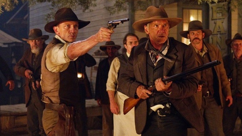 Lonergan and Dolarhyde point their guns in "Cowboys and Aliens" (2011)