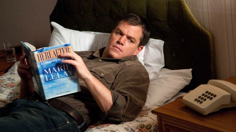 Matt Damon lies on a bed in "Hereafter" (2010)