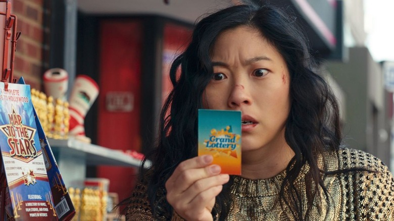 Katie looks upon her winning lottery ticket in "Jackpot!"