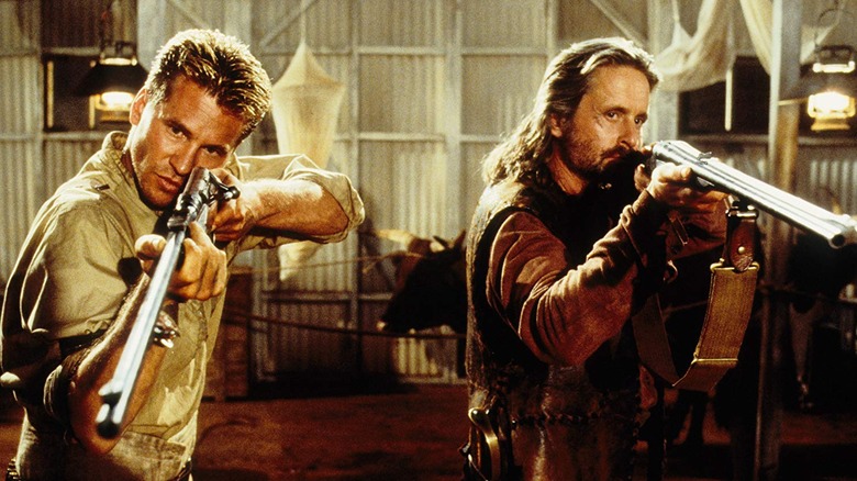 Patterson and Remington point their guns in "The Ghost and the Darkness" (1996)