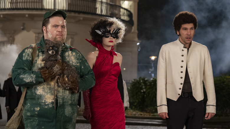 Paul Walter Hauser, Emma Stone and Joel Fry in "Cruella"