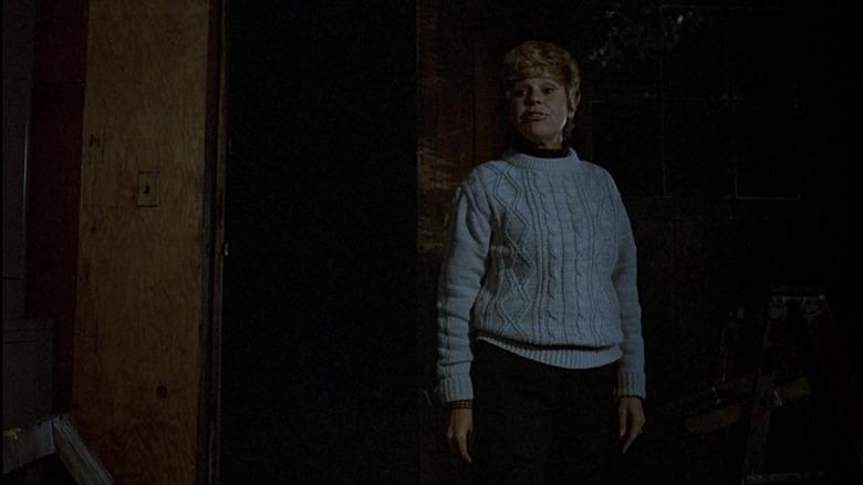 Mrs. Voorhees wearing a white sweater 