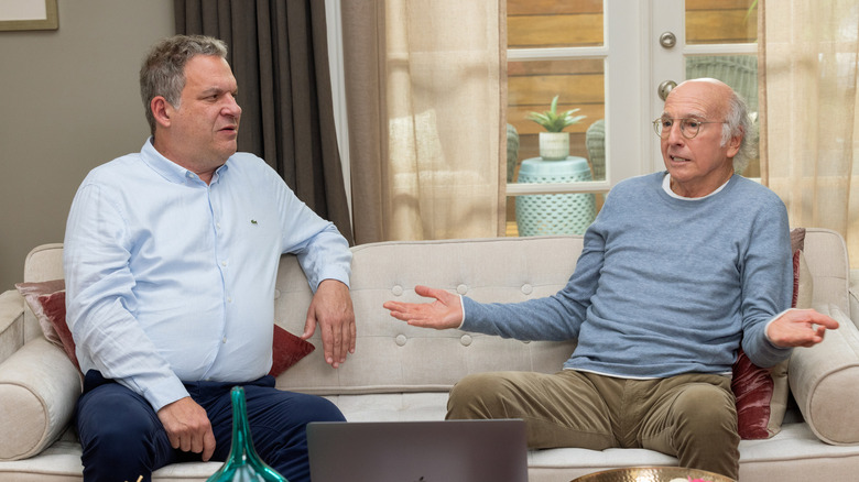 Jeff Garlin and Larry David sit on couch