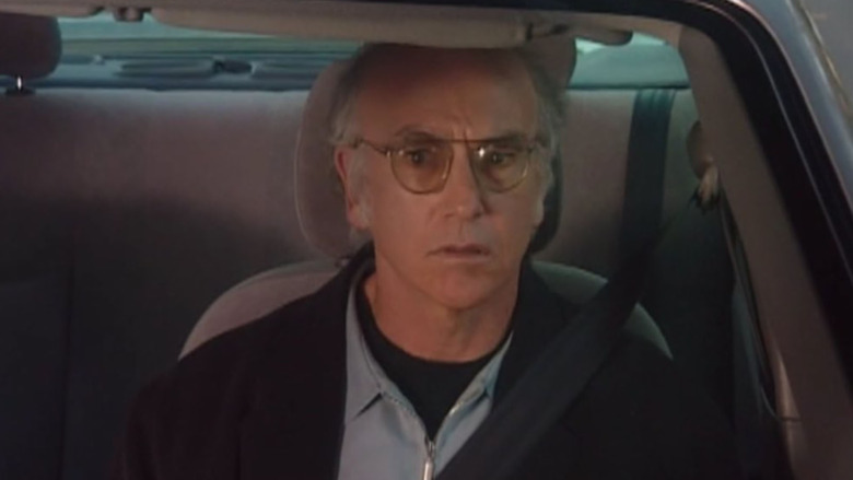 Larry David stares in traffic