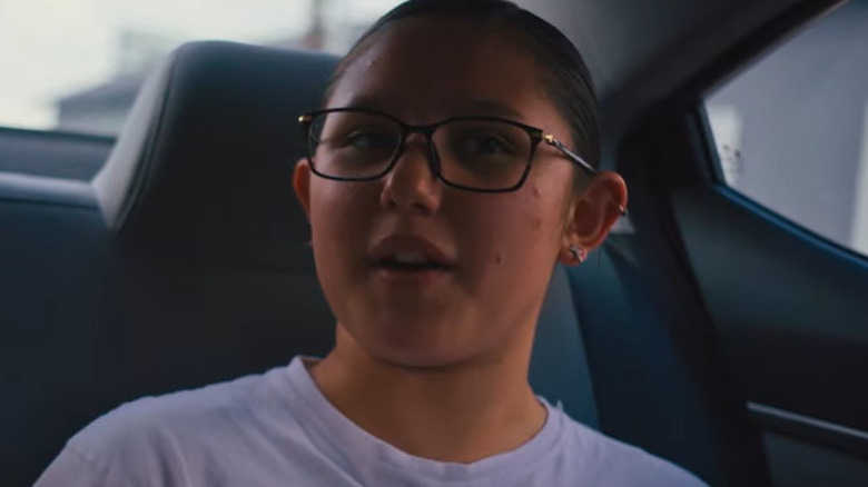 Girl with glasses in car