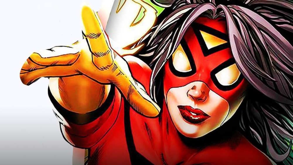 Spider-Woman points towards something