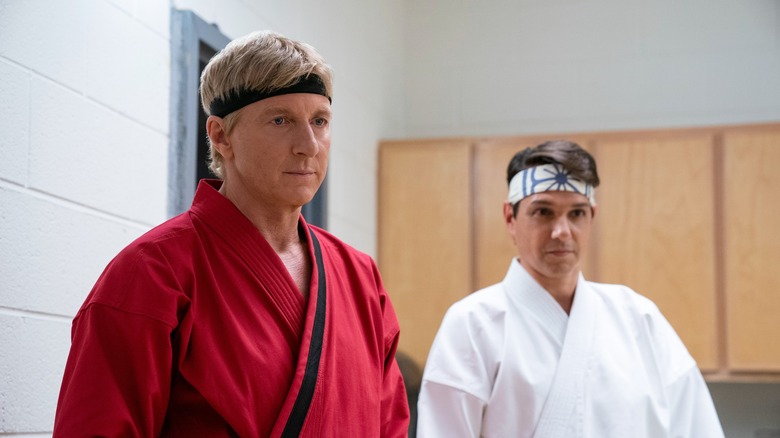 William Zabka and Ralph Macchio looking off camera in Cobra Kai