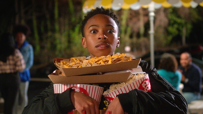 Dallas Dupree Young holding food in Cobra Kai 