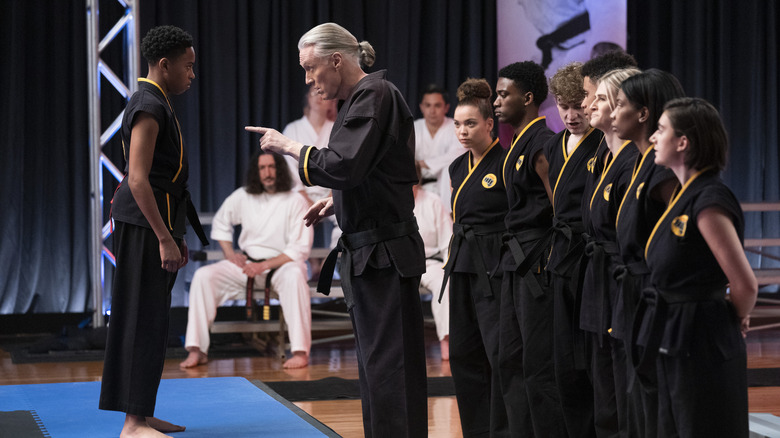 Dallas Dupree Young and Thomas Ian Griffith talking in Cobra Kai 