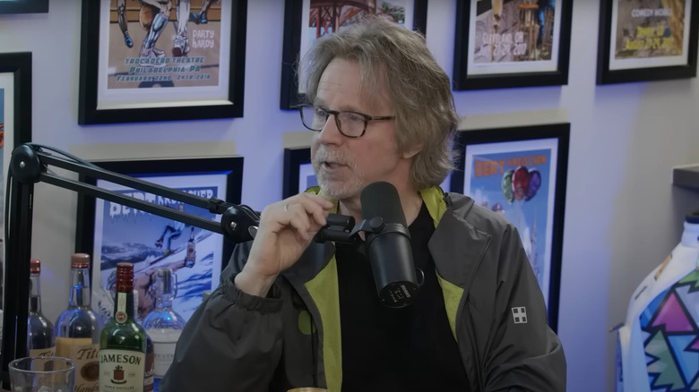 Dana Carvey talking into a microphone