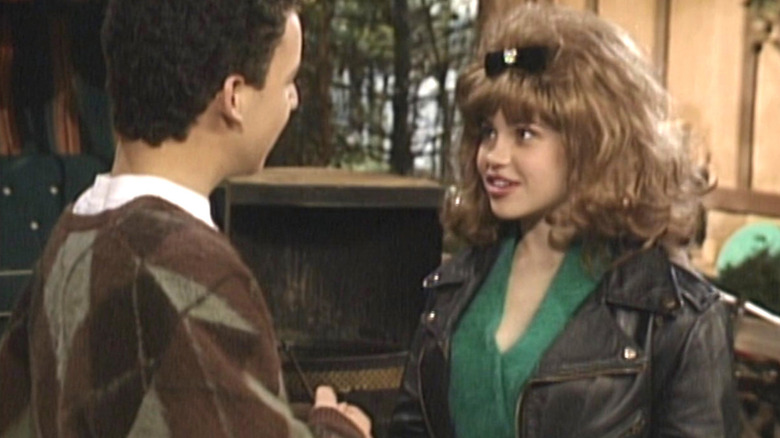 Topanga wearing a leather jacket