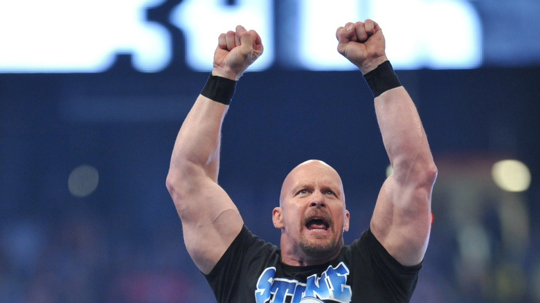 Stone Cold Steve Austin holding fists up in the air