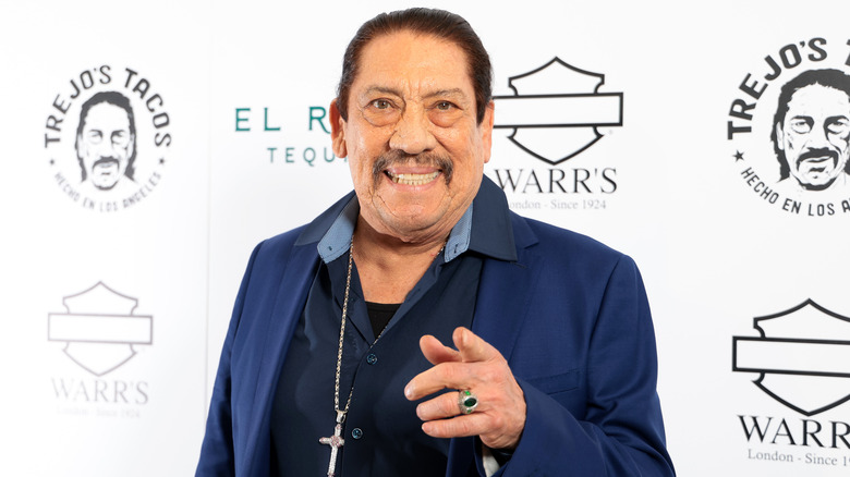 Danny Trejo smiling and pointing