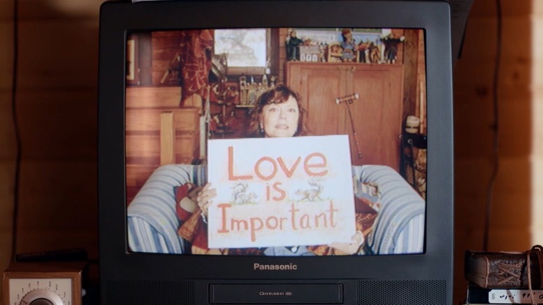 Honey holding "Love is Important" sign