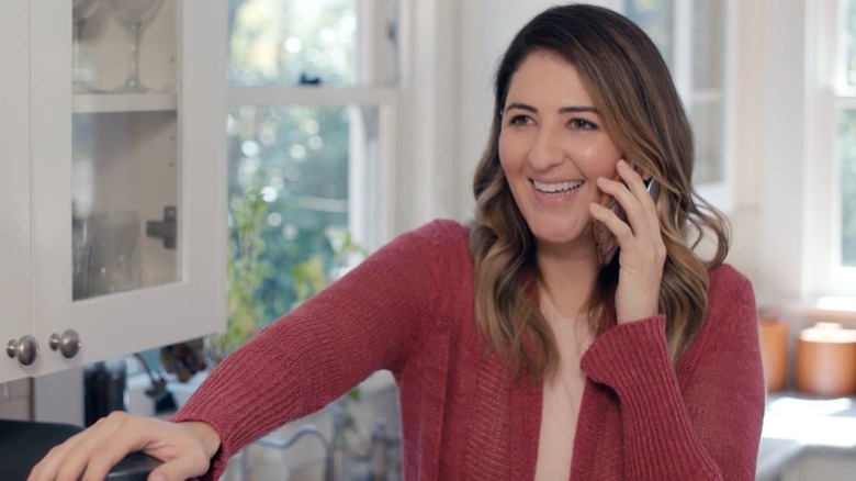 Audrey on the phone in the kitchen