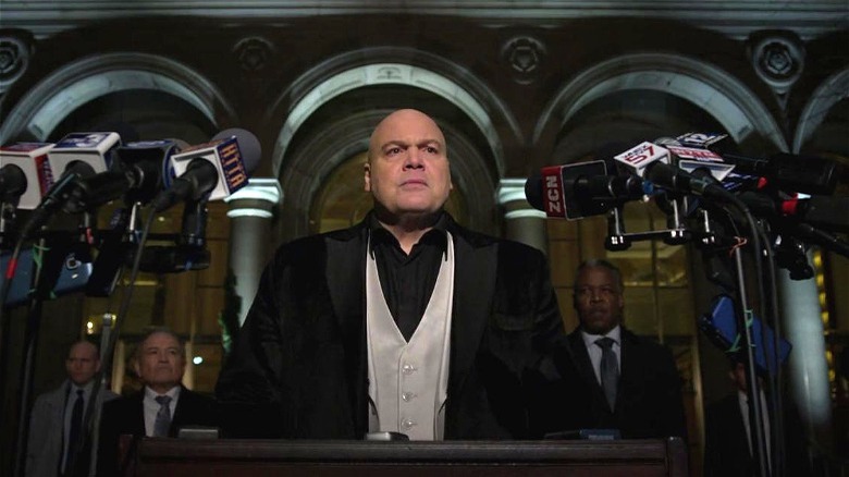 Wilson Fisk standing at mic