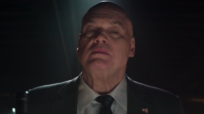 Wilson Fisk in the dark wearing a Stars and Stripes pin