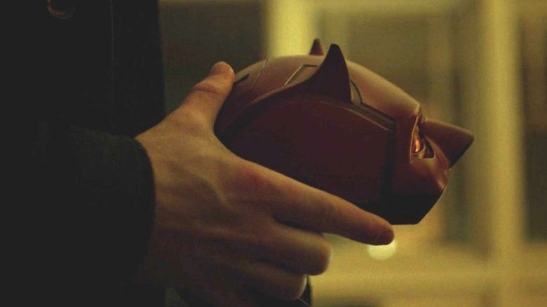 Matt Murdock holding Daredevil mask