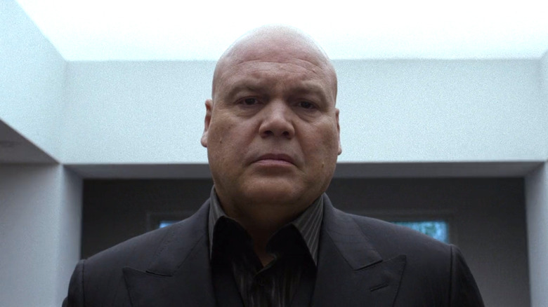 Kingpin looks in a mirror