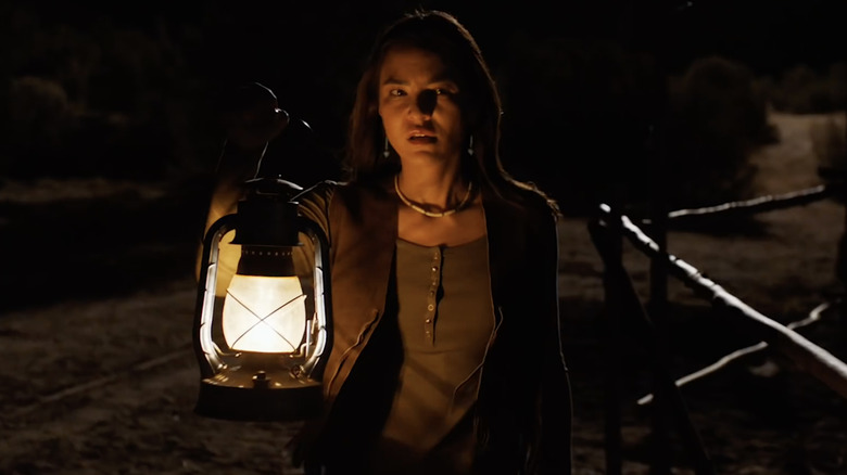 Bernadette Manuelito holding a lantern