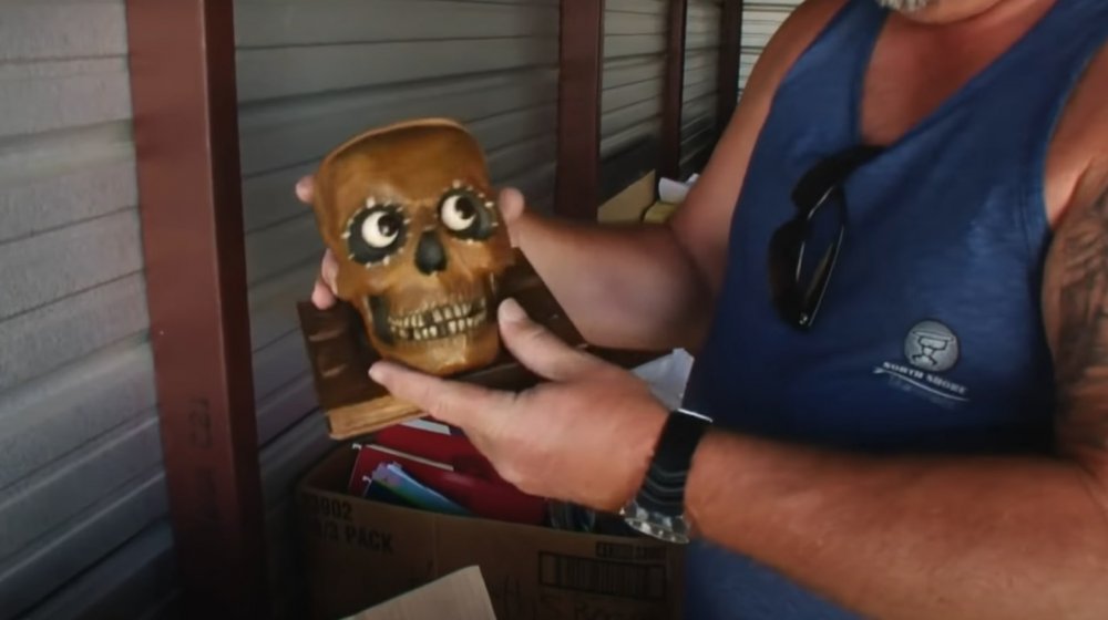 Darrell Sheets with a wooden skull clock on Storage Wars