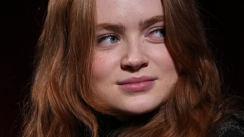 Sadie Sink looks to the right