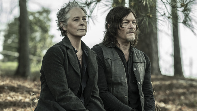 Daryl and Carol sitting on a bench