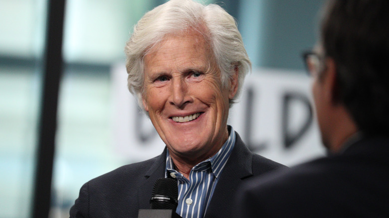 Keith Morrison smiling and holding a microphone