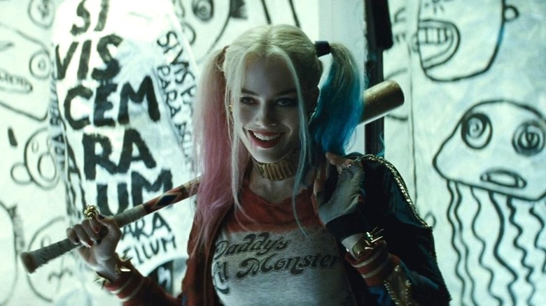 Harley Quinn holds a baseball bat