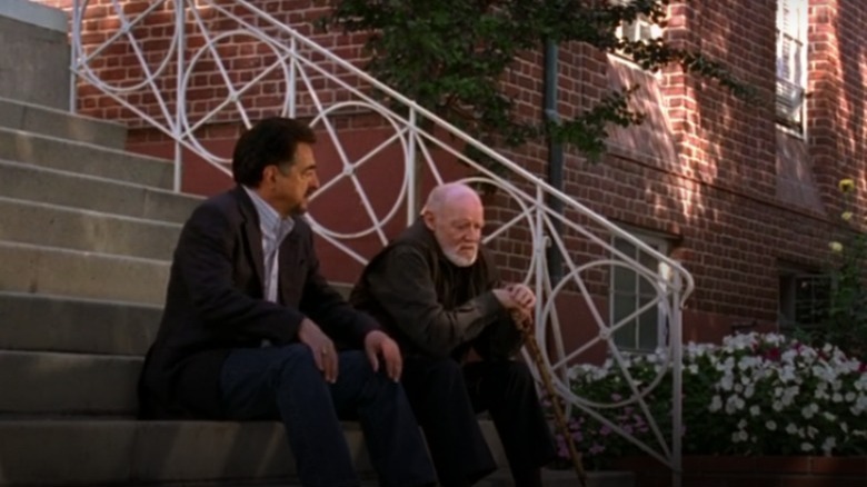 Rossi and Caulfield sitting on steps