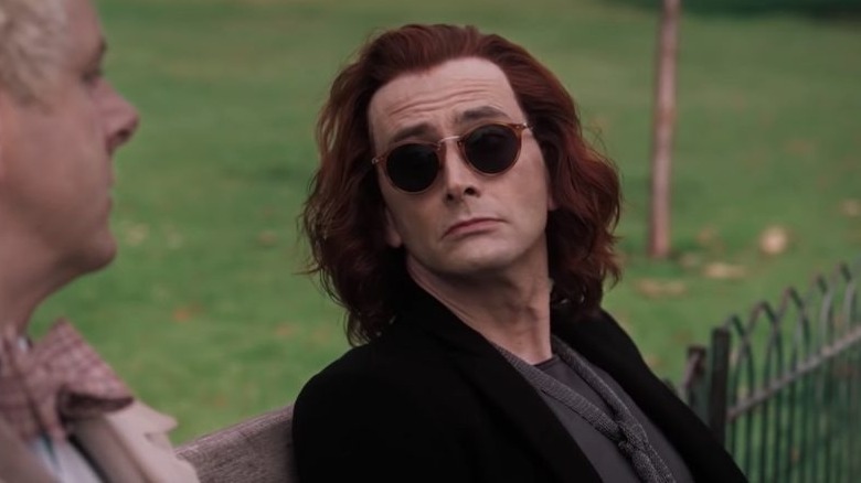 Crowley sitting on a bench