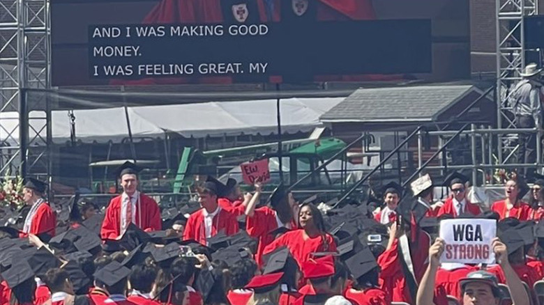 Students protesting during ceremony