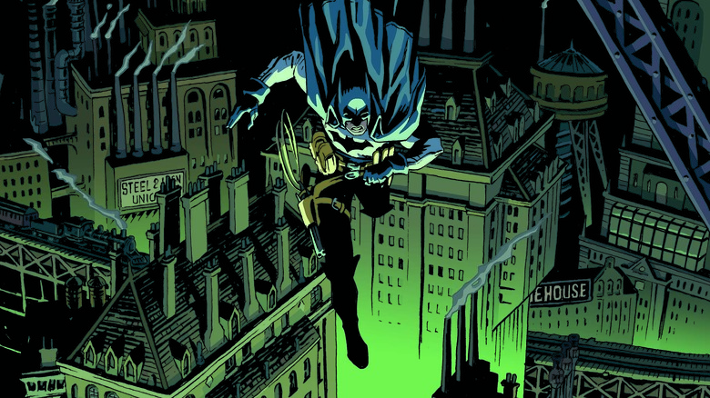 Batman swinging over Gotham City