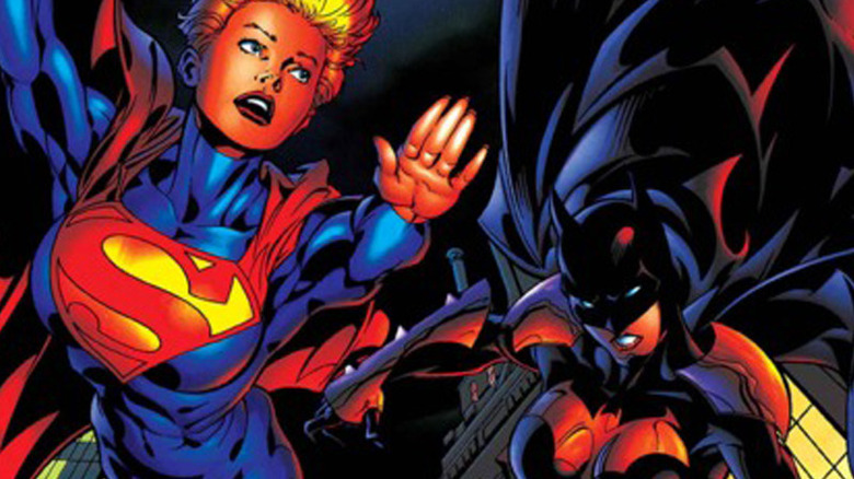 Supergirl and Batgirl flying around Gotham