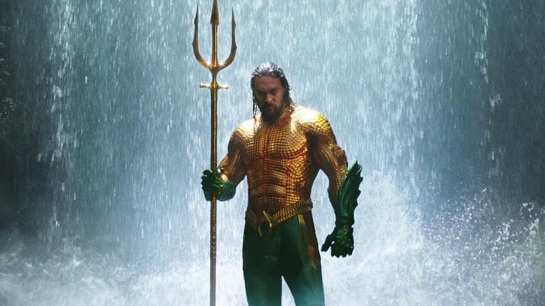 Jason Momoa clutching his trident