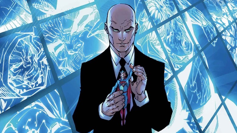 Lex Luthor holding a Superman figurine