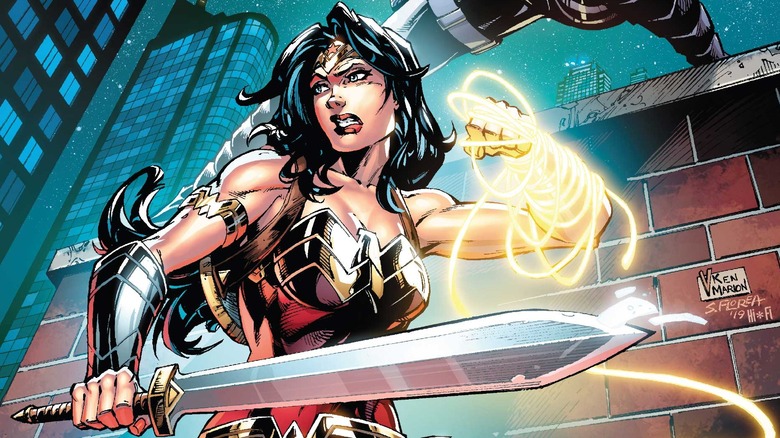 Wonder Woman holding a sword and the Lasso of Truth