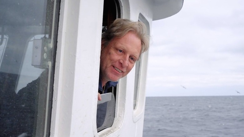 Sig Hansen sticking head outside boat window