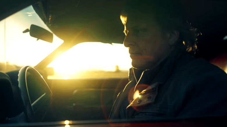 Sig Hansen driving a car during sunset 