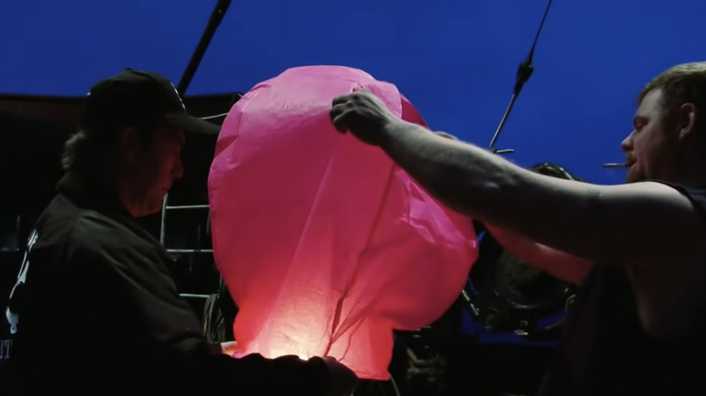 The Crew of the Time Bandit prepares a chinese lantern