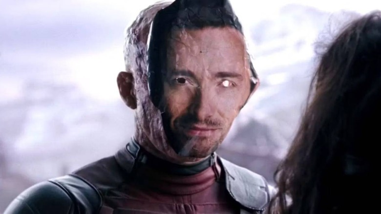 Deadpool wearing Hugh Jackman mask