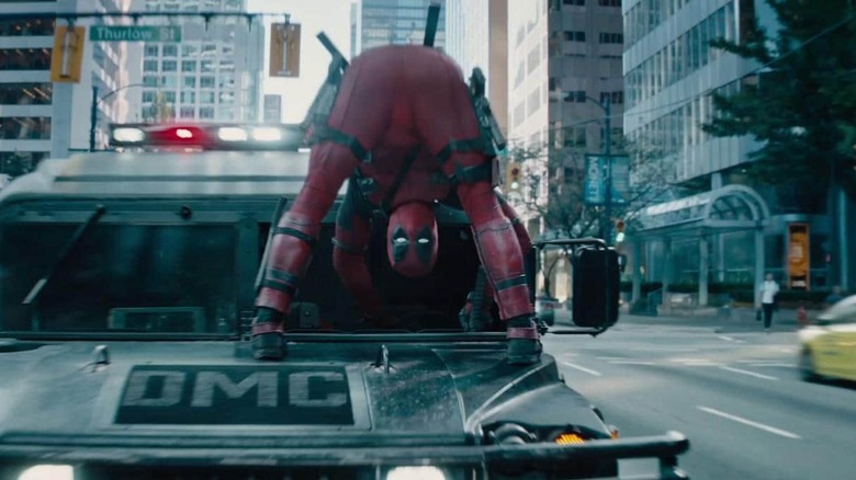 Deadpool looking between his legs