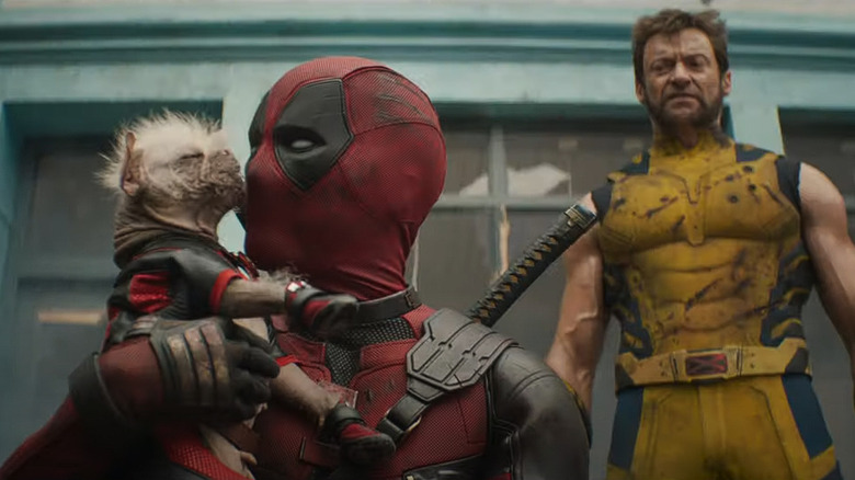 Wolverine watches Dogpool lick Deadpool