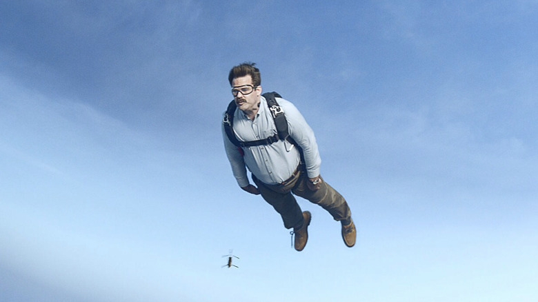 Peter skydiving with the plane in the background