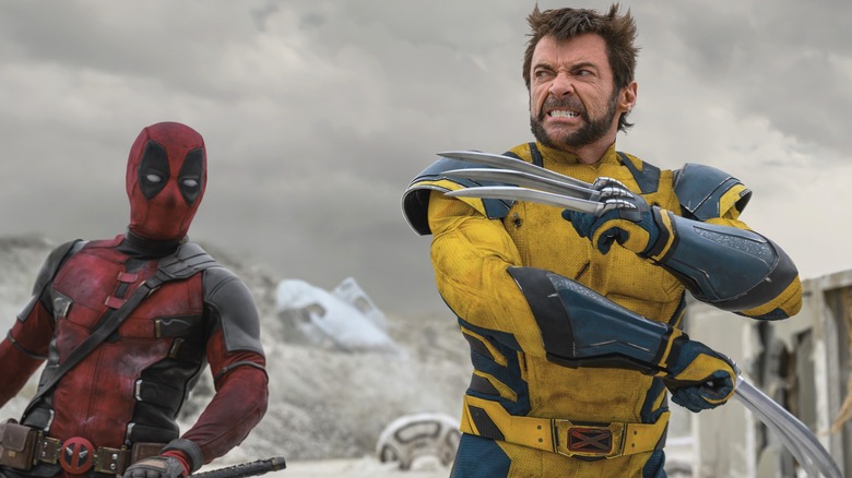 Deadpool looking at angry Wolverine