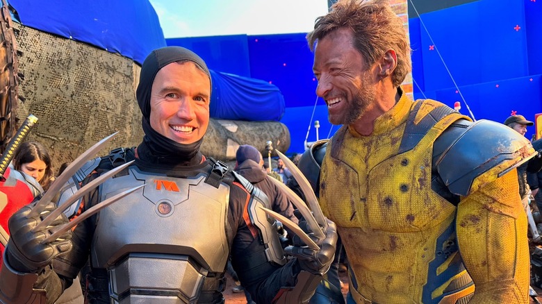 Hugh Jackman smiling at Rob McElhenney